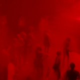 people dancing in red light